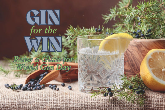 gin and tonic cocktail with lemons, juniper berries and juniper branches